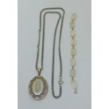 Aesthetic movement silver locket necklace with embossed and engraved decoration, plus a vintage