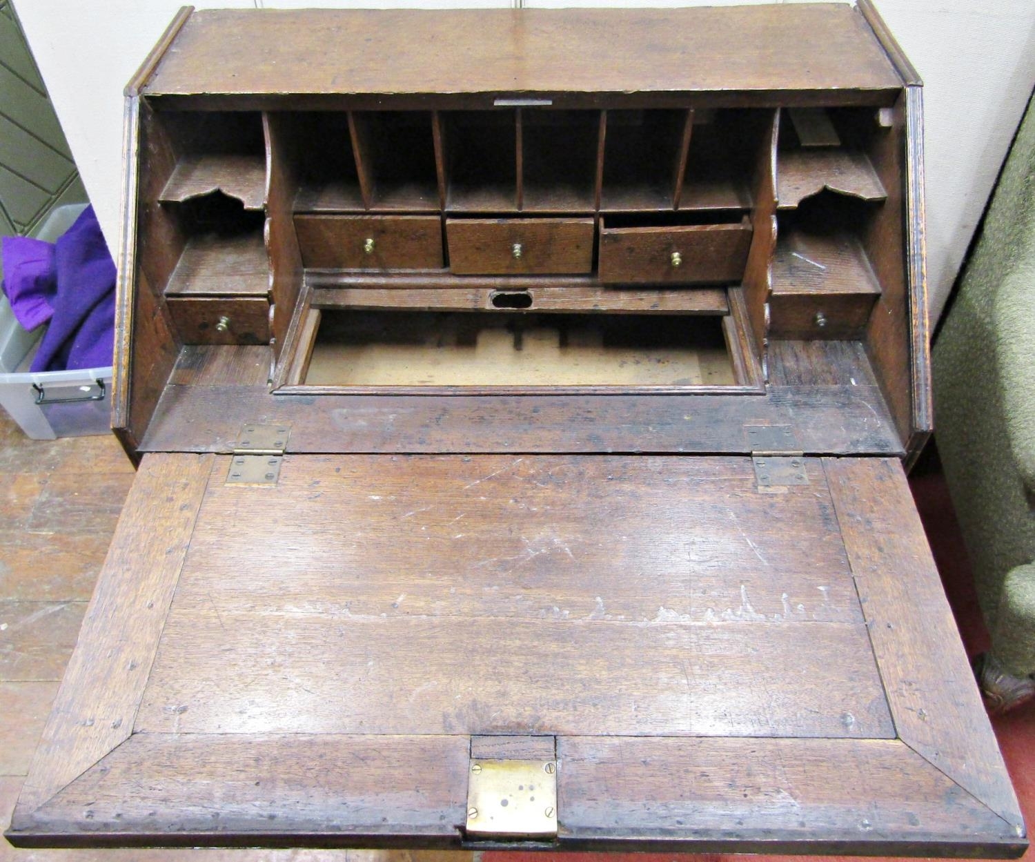 An 18th century oak countrymade writing bureau, the front elevation enclosed by two long and two - Image 2 of 3