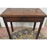 A simple Georgian mahogany foldover top tea table, over a single frieze drawer on square cut