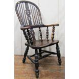 A 19th century Windsor elbow chair, principally in elm and other timbers, on turned supports and