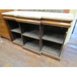 A Regency rosewood breakfront three sectional open bookcase with three cushion moulded drawers,