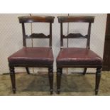 A set of five 19th century mahogany bar back dining chairs with carved scrolling foliate splats over