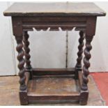 An old English oak joint stool on spiral supports