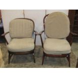 A pair of Ercol Windsor hoop and stick back open armchairs with dark stained beechwood frames and