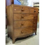 An early 19th century mahogany bow fronted bedroom chest, the top with inlaid crossbanded detail
