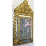 A small cushion wall mirror with central rectangular bevelled edge plate with applied repeating