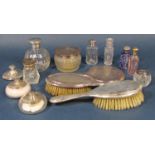 A large mixed collection of mainly silver dressing items to include five silver topped glass scent