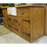 A rustic country kitchen freestanding kitchen sink unit, the base enclosed by four doors with