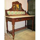 An Edwardian walnut marble top washstand with raised floral ceramic tiled splashback and rectangular