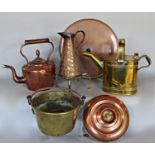 Copper and brassware collection including a copper kettle, jug and a hot water bottle and tray,