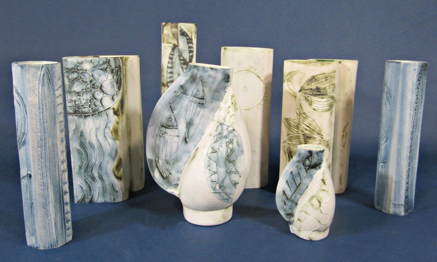 A collection of eight Carn Pottery Cornish studio pottery vases, all signed and numbered by John