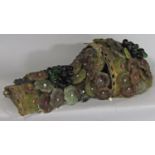 A single decorative wall light with glass floral decoration and glass beaded grapes