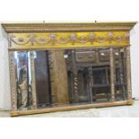 A Regency style overmantle mirror with triple bevelled edge mirror plates within a gilt moulded