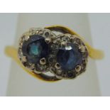 Early 20th century 18ct sapphire and diamond crossover ring, size K, 3.6g