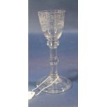 18th century Balustroid wine glass, with round funnel bowl engraved with flowers, raised on a