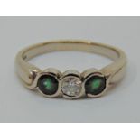 18ct white gold tsavorite (green garnet) and diamond three stone ring, maker 'SJ', Edinburgh 2003,