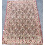 Persian Qom rug with geometric paisley design upon a cream ground, 200 x 135cm