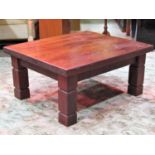 A low hardwood occasional table of rectangular form raised on four square cut and moulded