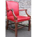 A reproduction Georgian style open armchair with red synthetic leather upholstered seat back and arm