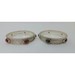 Guild of Handicrafts style pair of matched silver bangles of naturalistic reptile skin design, set