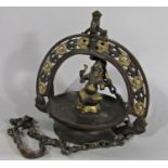 An Indian brass and copper hanging incense burner with central figure of Ganesh