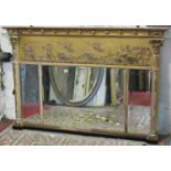 A Regency gilt framed overmantle mirror with triple bevelled edge plate, flanked by classical