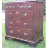 A mid-Georgian period chest of three long and two short drawers with brush slide - in oak, raised on