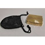 A vintage Stratton compact with gilt finish with musical box enclosed with black outer bag and