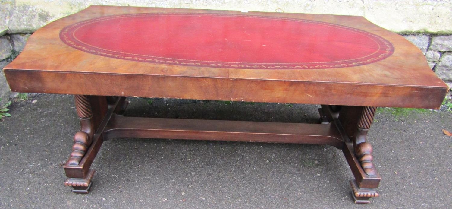 A mahogany occasional table in the Regency style, low rectangular form with serpentine shaped ends