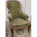 A Victorian drawing room chair with carved and moulded show-wood frame, raised on cabriole supports