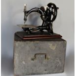 A Wilcox & Gibbs sewing machine and case, circa 1880