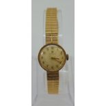 Vintage ladies Tissot 9ct dress watch, the champagne dial with Arabic numerals, 19mm case, upon a