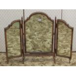 A Georgian style walnut veneered triple folding dressing table mirror with arched and moulded