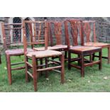 A pair of Georgian country made Chippendale style dining chairs with pierced vase shaped splats,