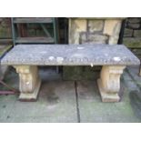 A reclaimed three sectional garden bench, the rectangular slab seat with repeating classical egg and