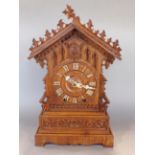 Bavarian oak Black Forest mantel cuckoo clock, with applied ivorine Roman numerals and twin train