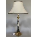 Corinthian column table lamp with black and white marble with gilt metal capital and base with a