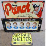 Three vintage style signs advertising 'Fry's milk chocolate', 'Punch jokes' and 'Air raid