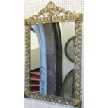A wall mirror of rectangular form, the cast gilt metal frame with neoclassical style detail, 60 cm
