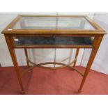 A good quality Edwardian satin wood vitrine of usual form, with plate glass panels, raised on square