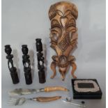 Mixed lot to include a Tribal carved wooden mask, three carved candlesticks, a silver coffee bean