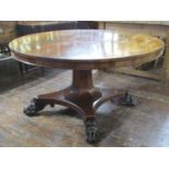 A Regency mahogany tea table, the circular top with well matched flame veneers, raised on an