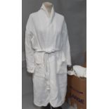 12 white waffle style bath/spa robes in large and medium sizes. CR: in good used condition
