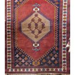 Baluchi type rug with central fawn medallion upon a washed red ground, 180 x 120cm