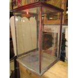 A late Victorian/Edwardian counter top shop display cabinet, with glazed panelled surround and