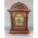 Late 19th century oak bracket clock, the case of architectural form with Wurttemberg three train