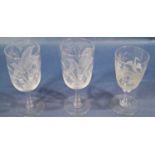 Three good quality 19th century etched glass stemmed wines, each with floral bird and insect