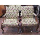 A pair of contemporary Gainsborough style open elbow chairs, the carved wood frames with floral,