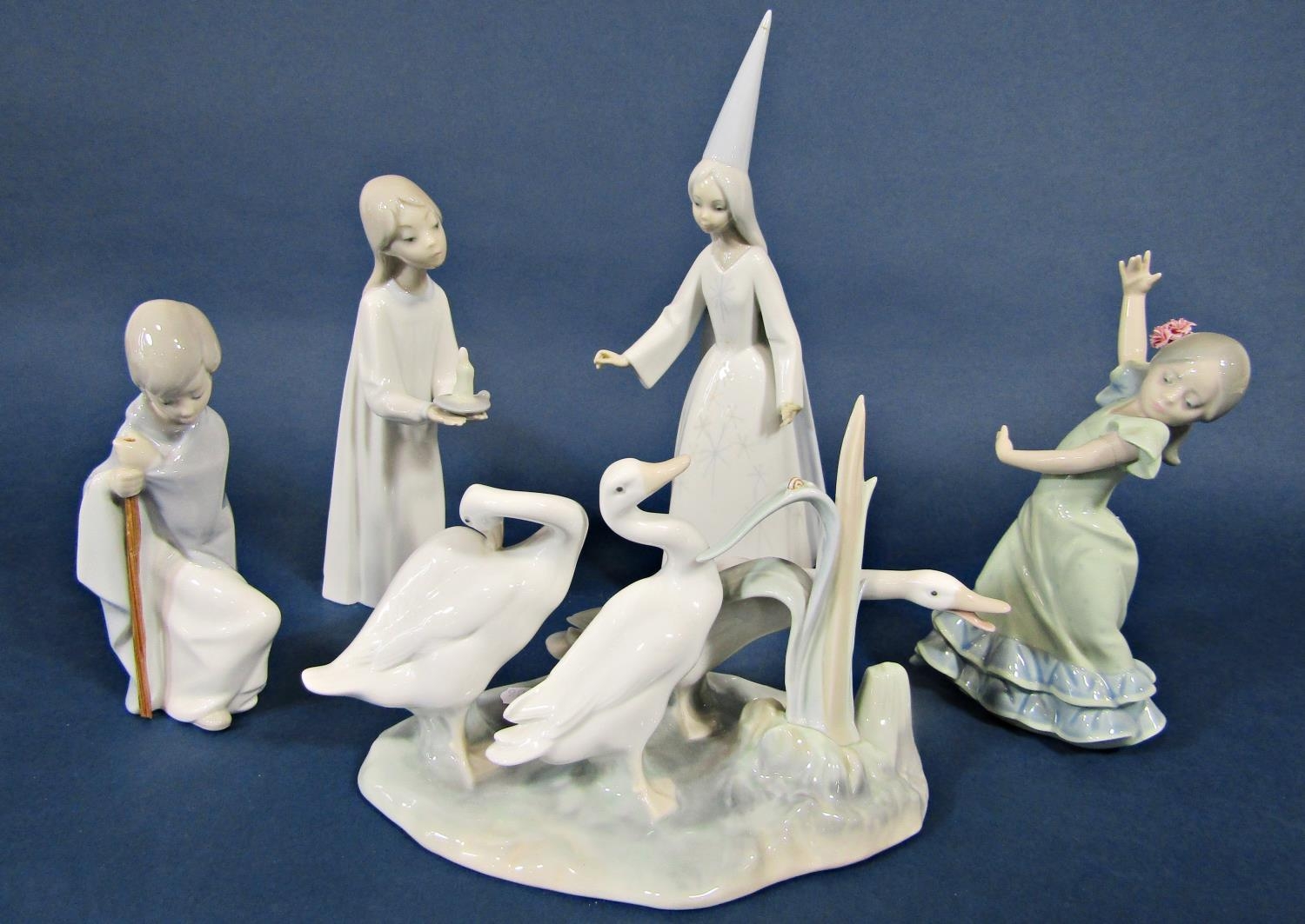 A collection of Lladro figure groups including three geese, a young witch, a girl with chamber