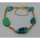 Antique style 15ct curb link bracelet with five turquoise beads of organic form, in the manner of
